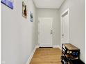 Inviting entryway with hardwood floors, a shoe rack, and neutral paint colors at 622 E 10Th St # 312, Indianapolis, IN 46202