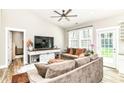 Bright living room with vaulted ceiling, ceiling fan, and comfortable sofa at 6301 Prospect St, Indianapolis, IN 46203