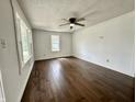 Bright living room featuring hardwood floors, neutral walls, and plenty of natural light at 692 S Crawford St, Martinsville, IN 46151