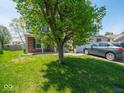 Two-story home with well-manicured lawn and driveway at 7611 Penguin Cir, Indianapolis, IN 46239