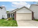 Attractive home with a spacious driveway and beautiful yard, perfect for suburban comfort at 8141 Maple Stream Ln, Indianapolis, IN 46217