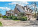 Well maintained brick home with lush landscaping and attached garage at 9719 Decatur Dr, Indianapolis, IN 46256