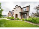 Charming two-story home with a stone facade and well-maintained landscaping at 9949 Stable Stone Ter, Fishers, IN 46040