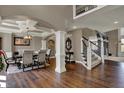 Dining room with wood floors and decorative columns at 13934 Salsbury Creek Dr, Carmel, IN 46032