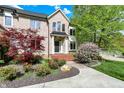 Brick home with brick stairs and lush landscaping at 13934 Salsbury Creek Dr, Carmel, IN 46032
