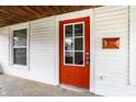 A close up of the front door with a window and modern mailbox at 1451 N Grant Ave, Indianapolis, IN 46201