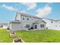 Expansive backyard with a garden and a patio, ideal for outdoor living and gardening at 192 Lynnette Way, Cumberland, IN 46229