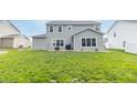Spacious backyard with lush green grass and patio space, perfect for outdoor enjoyment at 192 Lynnette Way, Cumberland, IN 46229