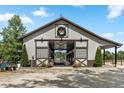 Equestrian barn featuring sliding doors, lighting, and ample space at 2450 S Us 421, Zionsville, IN 46077