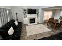 Cozy living room featuring a fireplace and built-in shelving at 3085 Oakmont Dr, Lapel, IN 46051