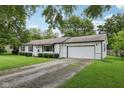 Inviting single-story home with white siding and a convenient attached two-car garage at 431 Fox Cir, Noblesville, IN 46060