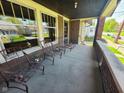 Inviting front porch with seating, perfect for relaxing and enjoying the neighborhood view at 551 E 40Th St, Indianapolis, IN 46205