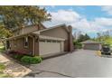 Spacious three-car garage with extra parking and a well-maintained driveway in a suburban setting at 5901 W Thompson Rd, Indianapolis, IN 46221