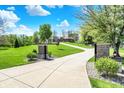 View of long driveway leading to beautiful home on expansive lot with lush green lawn at 6149 W Olive Branch Rd, Greenwood, IN 46143