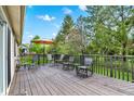 Spacious wooden deck with ample seating offers a perfect outdoor space for relaxation and entertaining guests in style at 6257 Old Barn Ct, Indianapolis, IN 46268