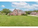 Beautiful home featuring a spacious backyard and large wooden deck at 801 Echo Trl, Martinsville, IN 46151