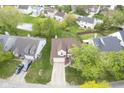 Aerial view of a residential home with green lawn, driveway, and surrounding neighborhood at 8875 White Fir Dr, Indianapolis, IN 46256
