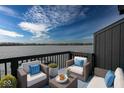Inviting balcony with cozy seating and scenic lake views, perfect for relaxation at 102 Clarendon Dr # 506, Noblesville, IN 46062