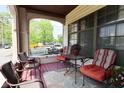 Inviting front porch featuring comfortable seating and a view of the neighborhood at 114 E 27Th St, Indianapolis, IN 46205