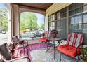 Cozy front porch featuring comfortable seating and a delightful outdoor ambiance at 114 E 27Th St, Indianapolis, IN 46205