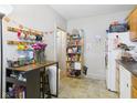 Efficient kitchen layout with a breakfast bar, open storage, and ample natural light at 1408 W Jackson St, Muncie, IN 47303
