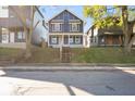 Attractive two-story home featuring well-kept landscaping and a classic architectural design at 1417 E Michigan St, Indianapolis, IN 46201