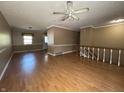 Spacious living room featuring hardwood floors, ample natural light, and a ceiling fan at 1705 Witt Rd, Lebanon, IN 46052