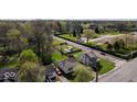 A peaceful community with mature trees, a park, and well-maintained homes at 3511 N Keystone Ave, Indianapolis, IN 46218