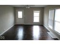 Bright living room showcasing hardwood floors and natural light from multiple windows at 5080 Norwaldo Ave, Indianapolis, IN 46205