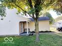 Charming two-story home featuring a manicured lawn at 5411 Cliff Ridge Dr, Indianapolis, IN 46217