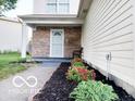 Charming two-story home featuring a brick facade and a meticulously landscaped yard at 5411 Cliff Ridge Dr, Indianapolis, IN 46217