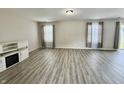 A spacious living room with modern floors and light-colored walls, offering a bright and inviting atmosphere at 5411 Cliff Ridge Dr, Indianapolis, IN 46217