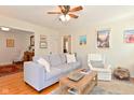 Inviting living room with hardwood floors, a comfortable gray sofa, and stylish decor at 5938 Haverford Ave, Indianapolis, IN 46220