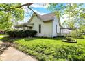 Well-maintained home exterior with mature trees and a spacious yard at 704 Baronne St, Lebanon, IN 46052