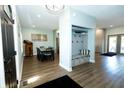 Open entryway with light blue walls, wood floors, and a convenient mudroom storage bench at 7926 White Pine Dr, Avon, IN 46123