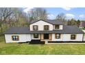 Aerial view of a charming home with lush green lawn, and eye-catching trim at 8315 N Payne Rd, Indianapolis, IN 46268