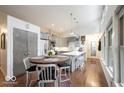 Bright kitchen with gray cabinets, stainless steel appliances, and a modern eat-in island and breakfast nook at 949 Harrison St, Indianapolis, IN 46202