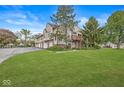 Well-maintained building exterior with a lush green lawn, providing a welcoming curb appeal at 9553 Maple Way, Indianapolis, IN 46268