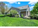 Beautiful backyard with well-maintained lawn, manicured landscaping, and a serene outdoor setting at 10992 Chapel Woods S Blvd, Noblesville, IN 46060