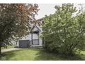 View of a home's exterior with a well-kept lawn and a variety of trees at 110 Meadow Creek Blvd, Whiteland, IN 46184
