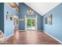 Bright living room with wood floors, sliding glass doors, and backyard view at 11424 Geist Valley Dr, Indianapolis, IN 46236
