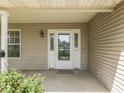 Inviting front porch with a decorative glass door, sidelights, and space for personalized touches at 1858 Jenny Dr, Martinsville, IN 46151