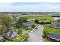 Panoramic aerial view of neighborhood with lush trees, revealing blue house close to highways at 2263 N Rural St, Indianapolis, IN 46218