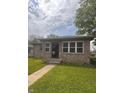 Charming brick home with manicured lawn and inviting entrance at 2402 S Rybolt Ave, Indianapolis, IN 46241