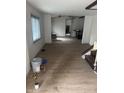 Open living room with window, view of doorway and stairs at 2425 S Lyons Ave, Indianapolis, IN 46241