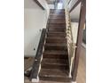 A clear view of the home's wooden staircase with decorative railing at 2425 S Lyons Ave, Indianapolis, IN 46241
