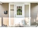 Close-up of the white front door with a wreath and the house number 4406 at 4406 Carrollton Ave, Indianapolis, IN 46205