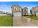 Inviting two-story house with attached two-car garage, neat lawn, and landscaped front yard at 5845 Cresswell Ln, Whitestown, IN 46075