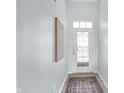Entryway with natural lighting, and white front door with a decorative glass insert, and a patterned rug at 6241 Colonial Dr, Whitestown, IN 46075