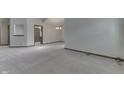 Spacious living area with neutral carpet, light walls, chandelier, and an open doorway into the next room at 948 Peppermill Run, Greenwood, IN 46143